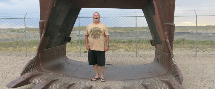 Miner Kent Parrish stands in a coal shovel at a roadside viewing platform for the Eagle Butte coal mine outside of Gillette, Wyoming. Photo: Leigh Paterson / Inside Energy