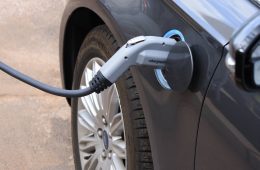 An electric car plugged in and charging