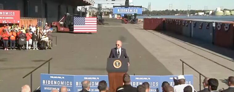 President Biden at a podium in front of reporters at Tioga Marine Terminal in the Port of Philadelphia