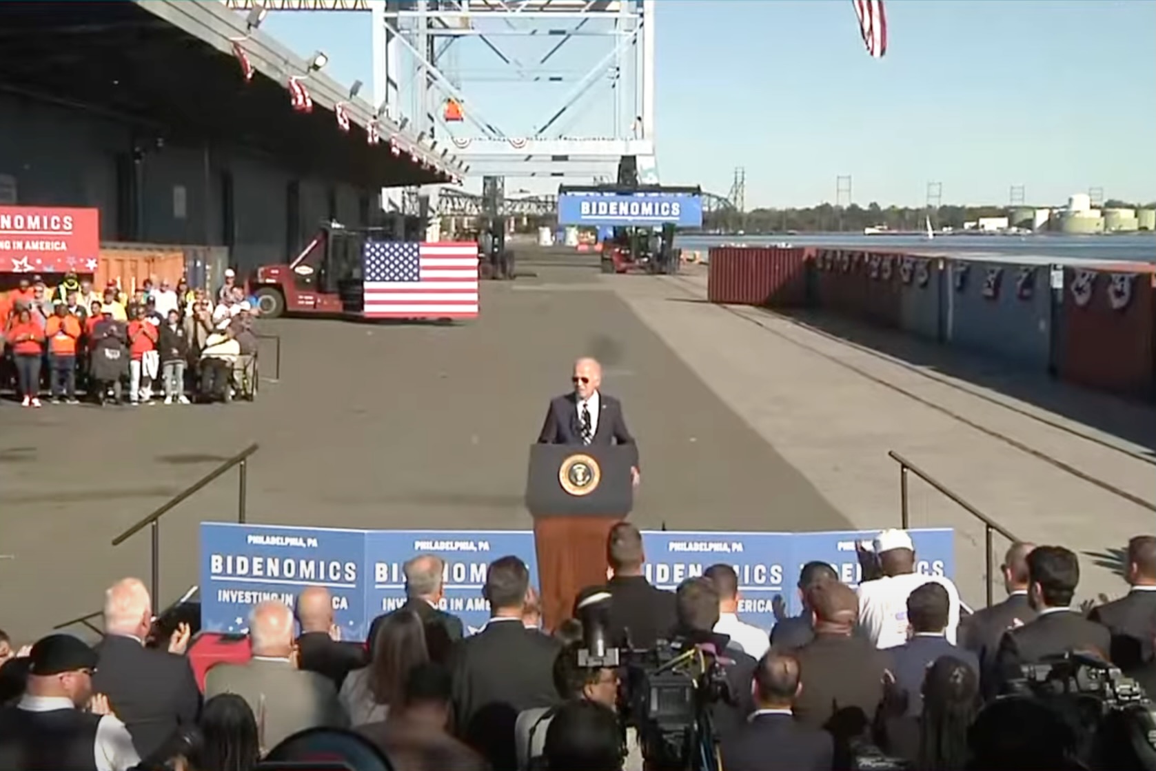 President Biden at a podium in front of reporters at Tioga Marine Terminal in the Port of Philadelphia