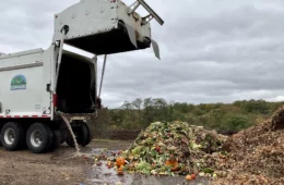 Dump truck next to a pile of food scraps