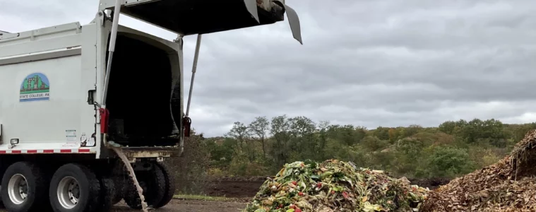 Dump truck next to a pile of food scraps