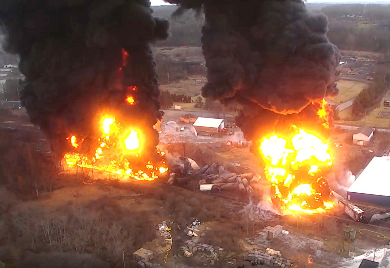 2 huge fires with black smoke seen from above