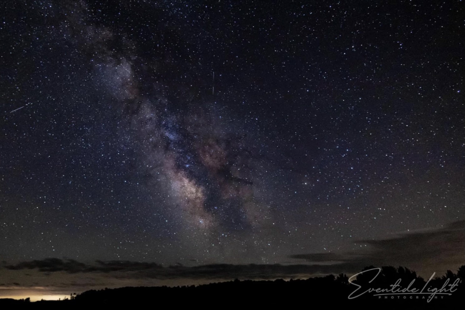 The Milky Way is visible in the night sky.