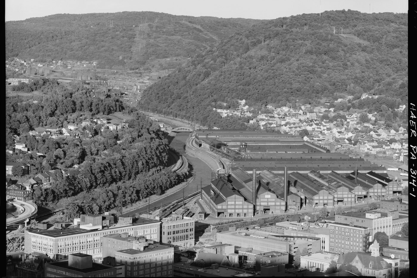 A black and white image of an aerial view of an iron plant