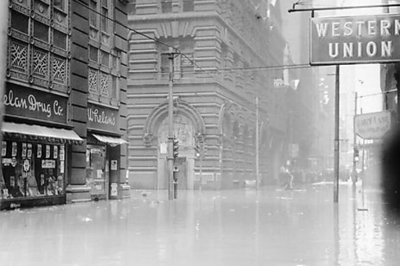 A black and white photo of floodwaters in Pittsburgh city streets