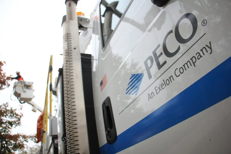 A close up of a white utility truck that reads, "PECO."