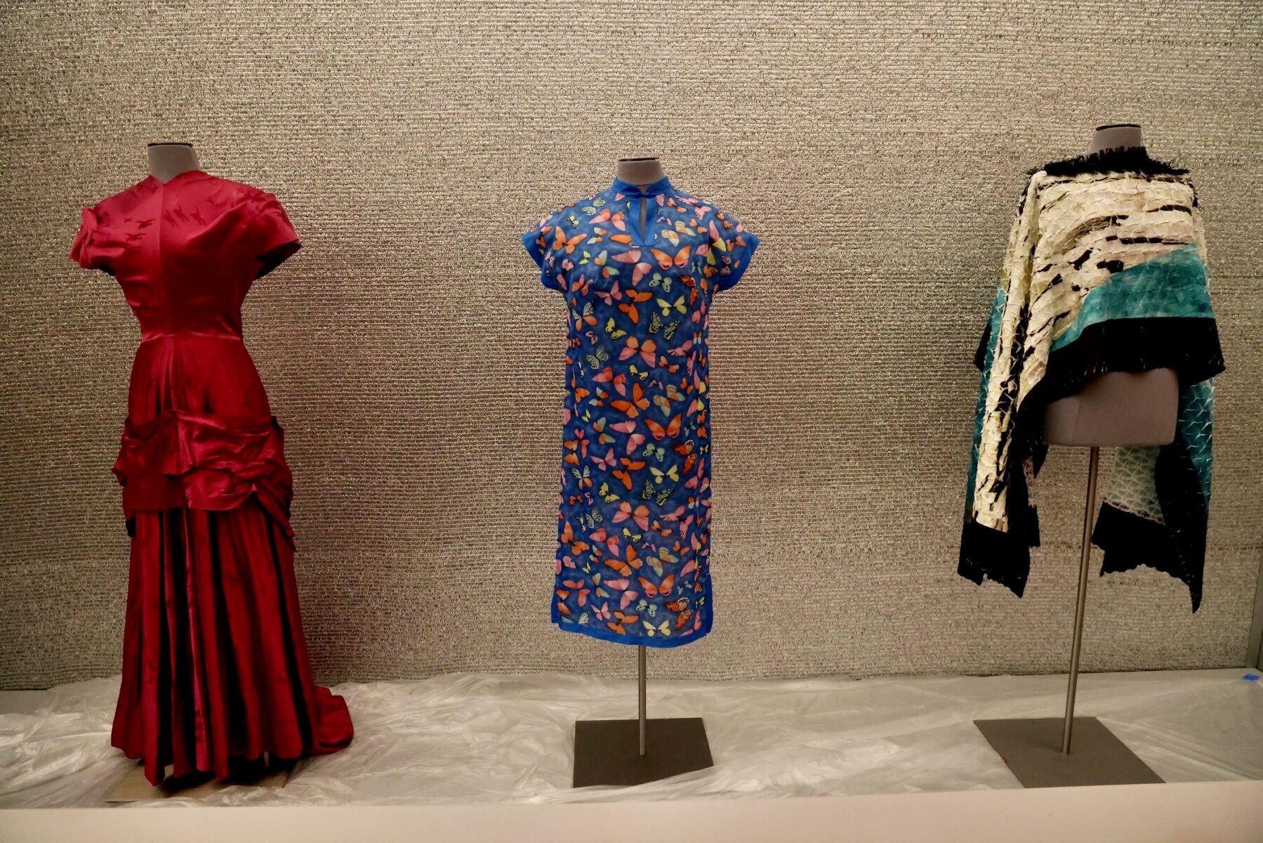 Three dresses on display.