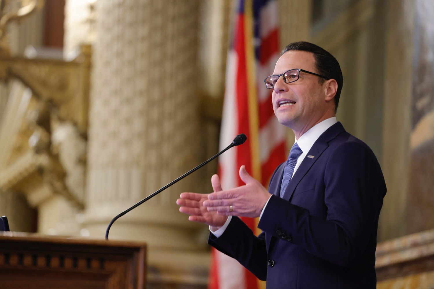 Governor Shapiro speaks at a podium.